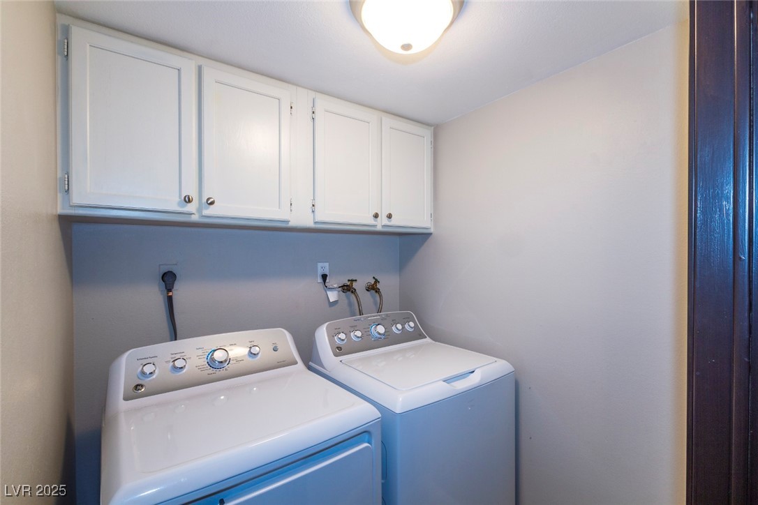 730 South Royal Crest Circle, Unit 421 Las Vegas, NV 89169 - Photo 10 of 21 Washroom featuring washing machine and clothes dry