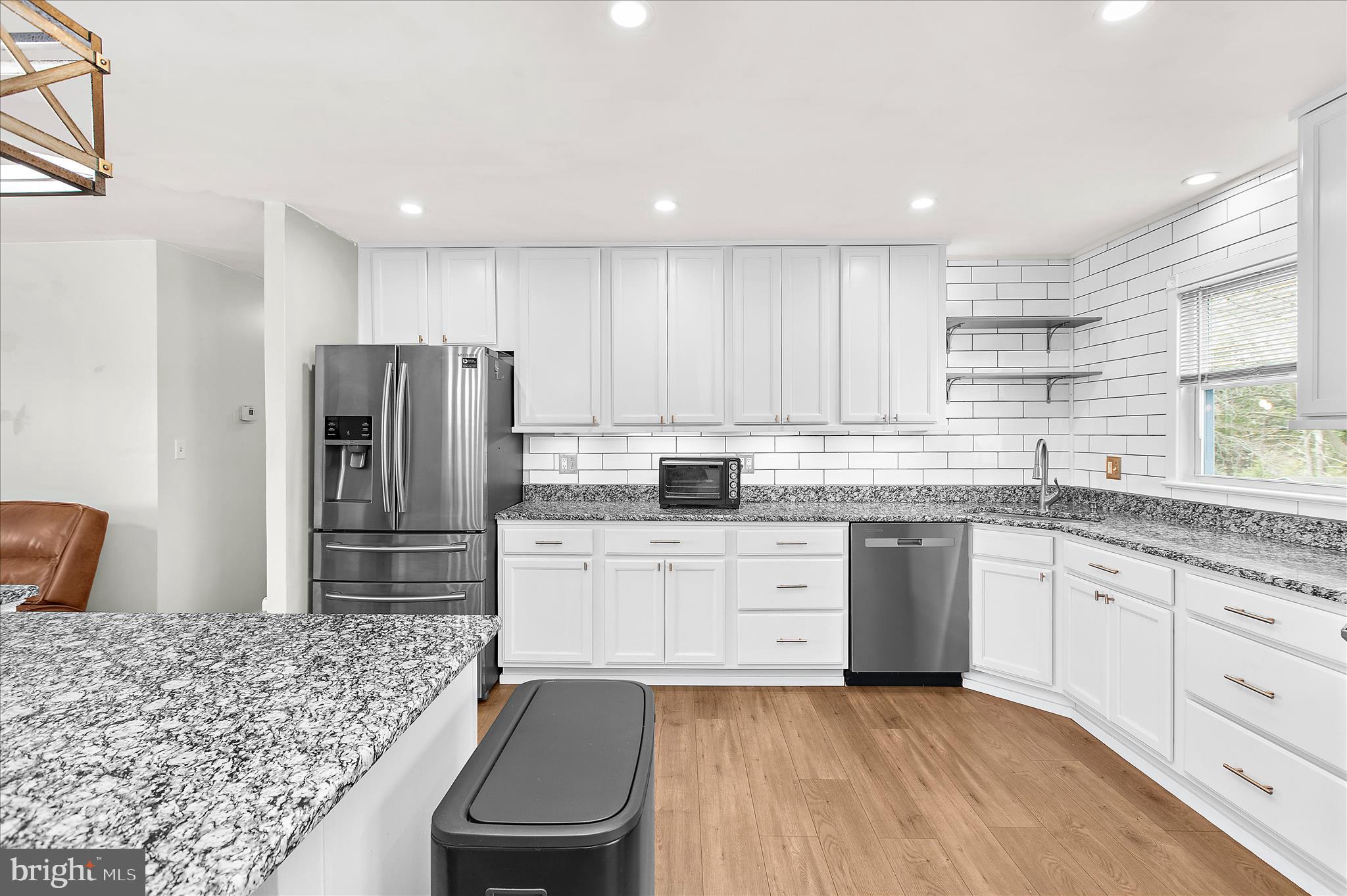 9140 Vollmerhausen Road Savage, MD 20794 - Photo 14 of 49 a kitchen with a refrigerator sink and cabinets