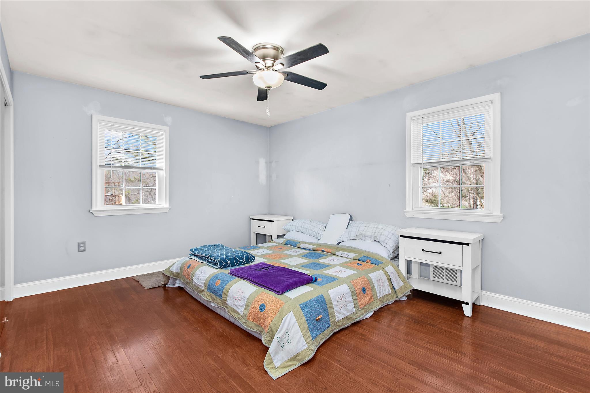 9140 Vollmerhausen Road Savage, MD 20794 - Photo 22 of 49 a bedroom with a bed and a chandelier