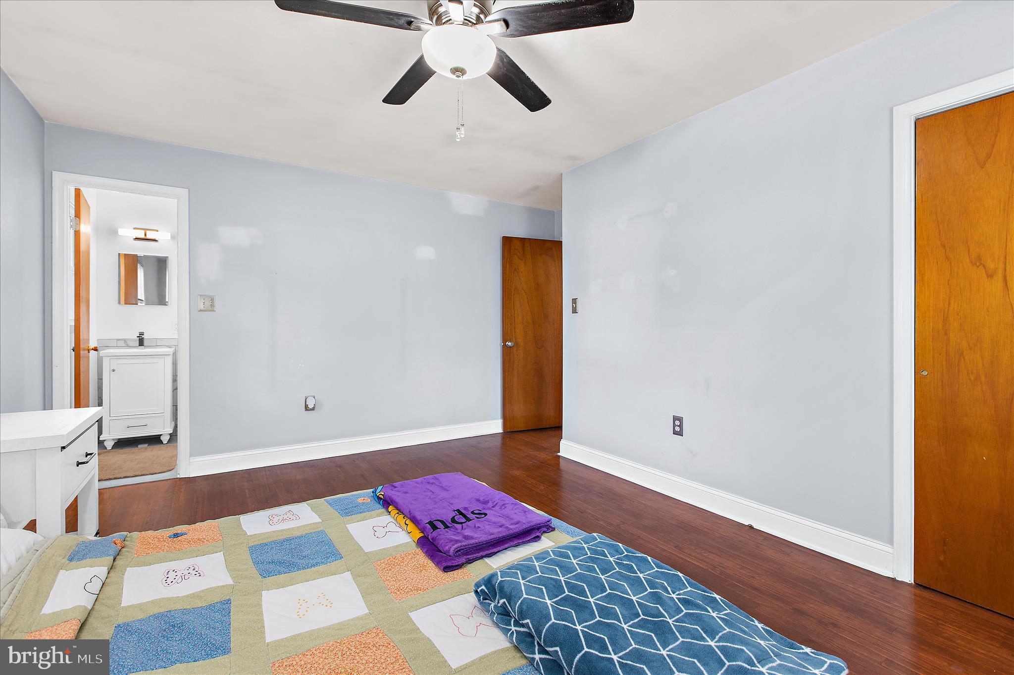 9140 Vollmerhausen Road Savage, MD 20794 - Photo 24 of 49 a bedroom with a bed and a wooden floor