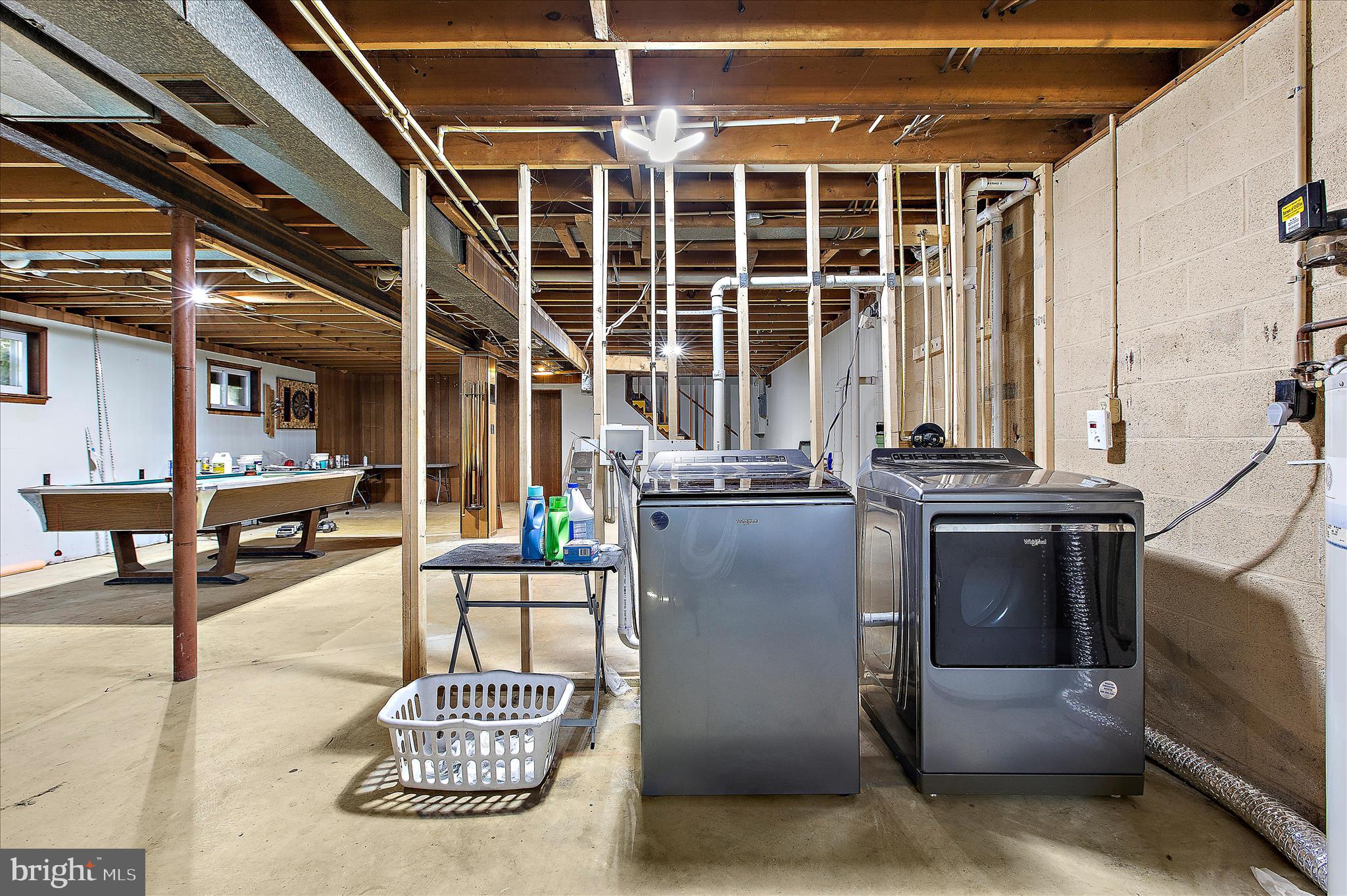 9140 Vollmerhausen Road Savage, MD 20794 - Photo 29 of 49 a living room with furniture and a large window