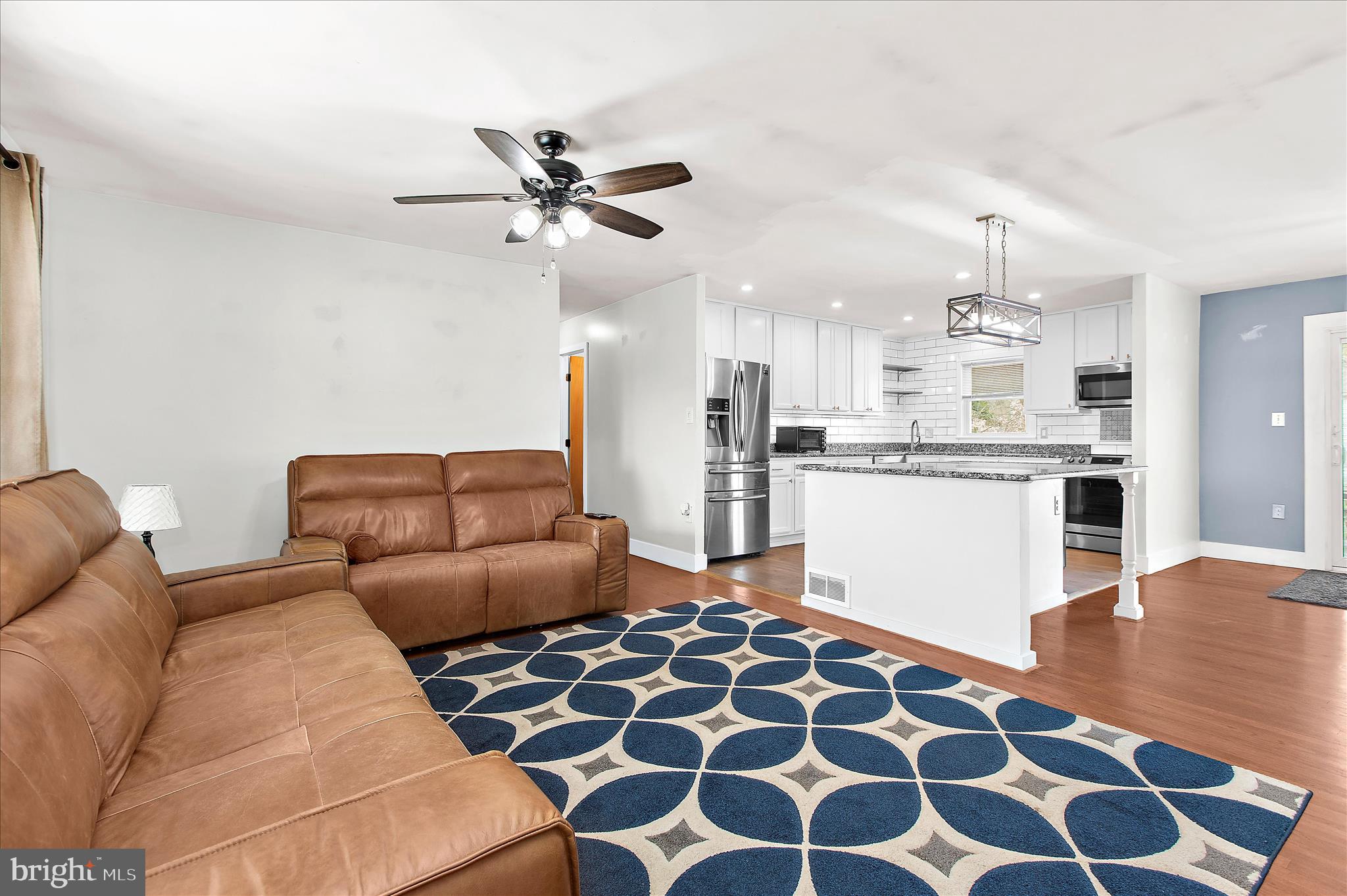 9140 Vollmerhausen Road Savage, MD 20794 - Photo 3 of 49 a living room with furniture and kitchen view