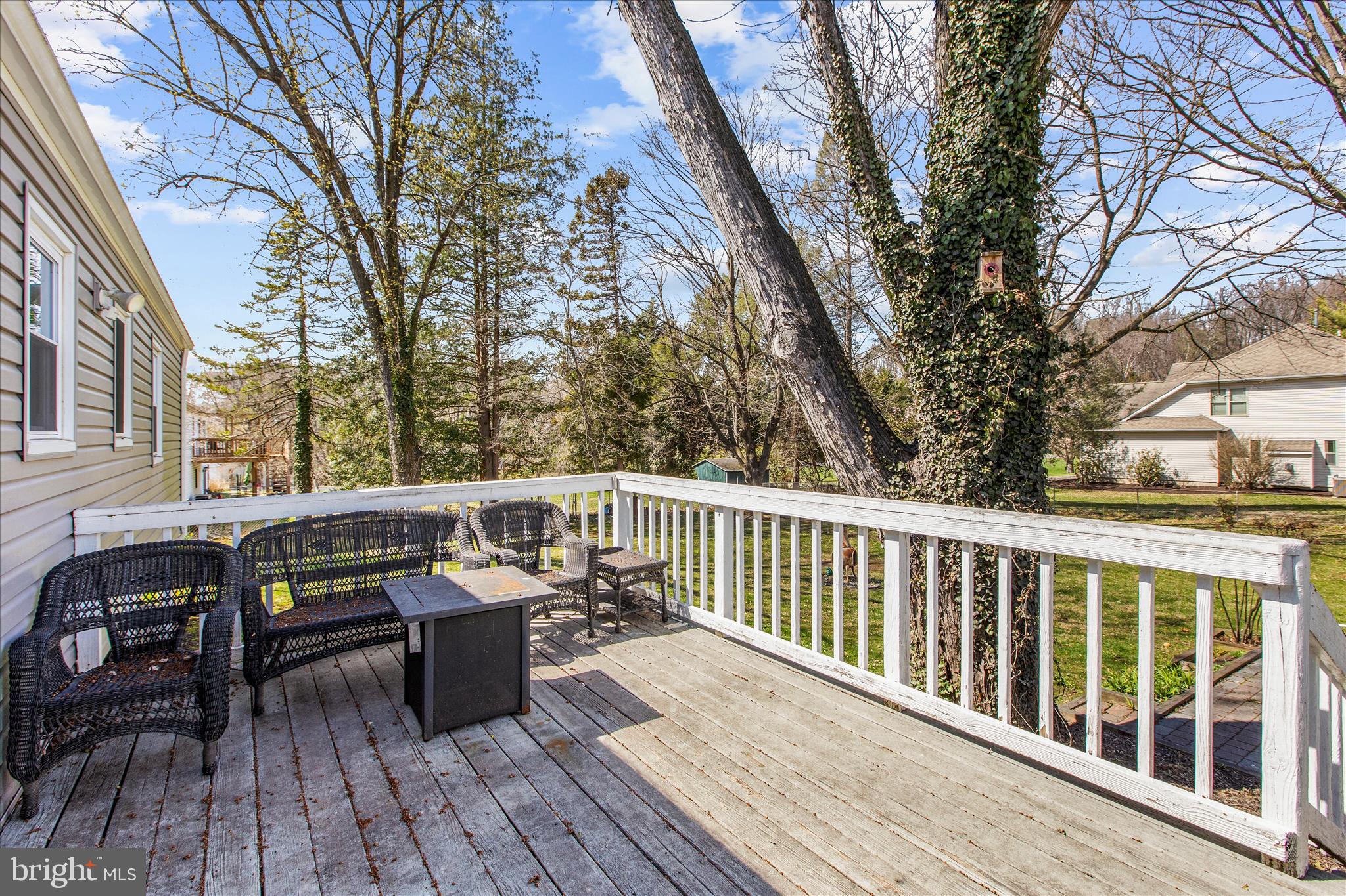 9140 Vollmerhausen Road Savage, MD 20794 - Photo 36 of 49 a view of balcony with wooden floor and seating