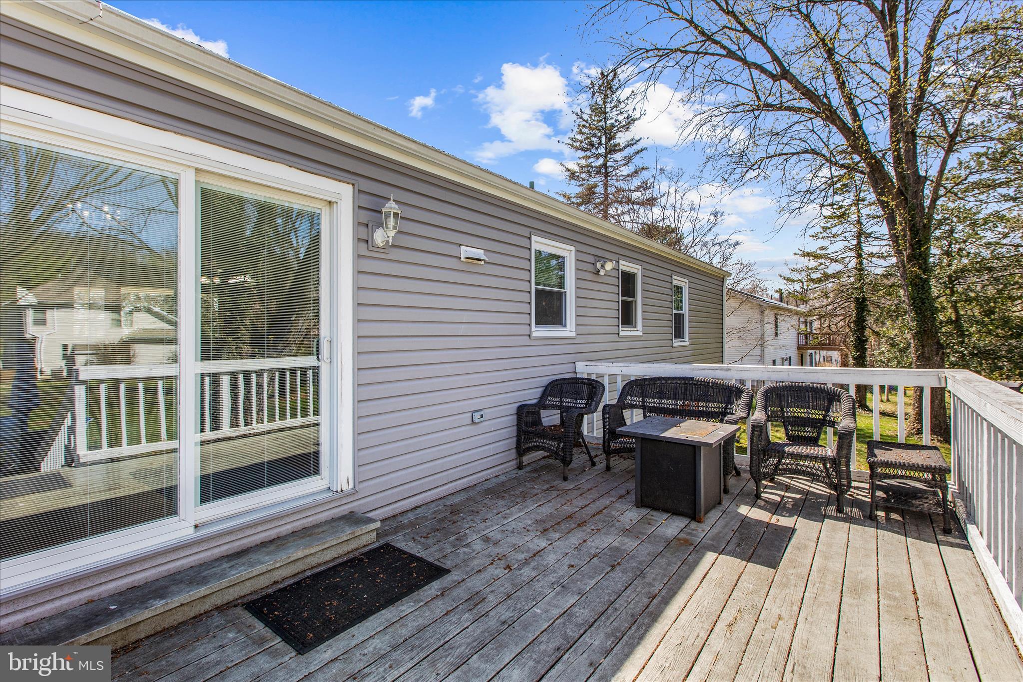9140 Vollmerhausen Road Savage, MD 20794 - Photo 38 of 49 a view of a wooden chairs on the deck