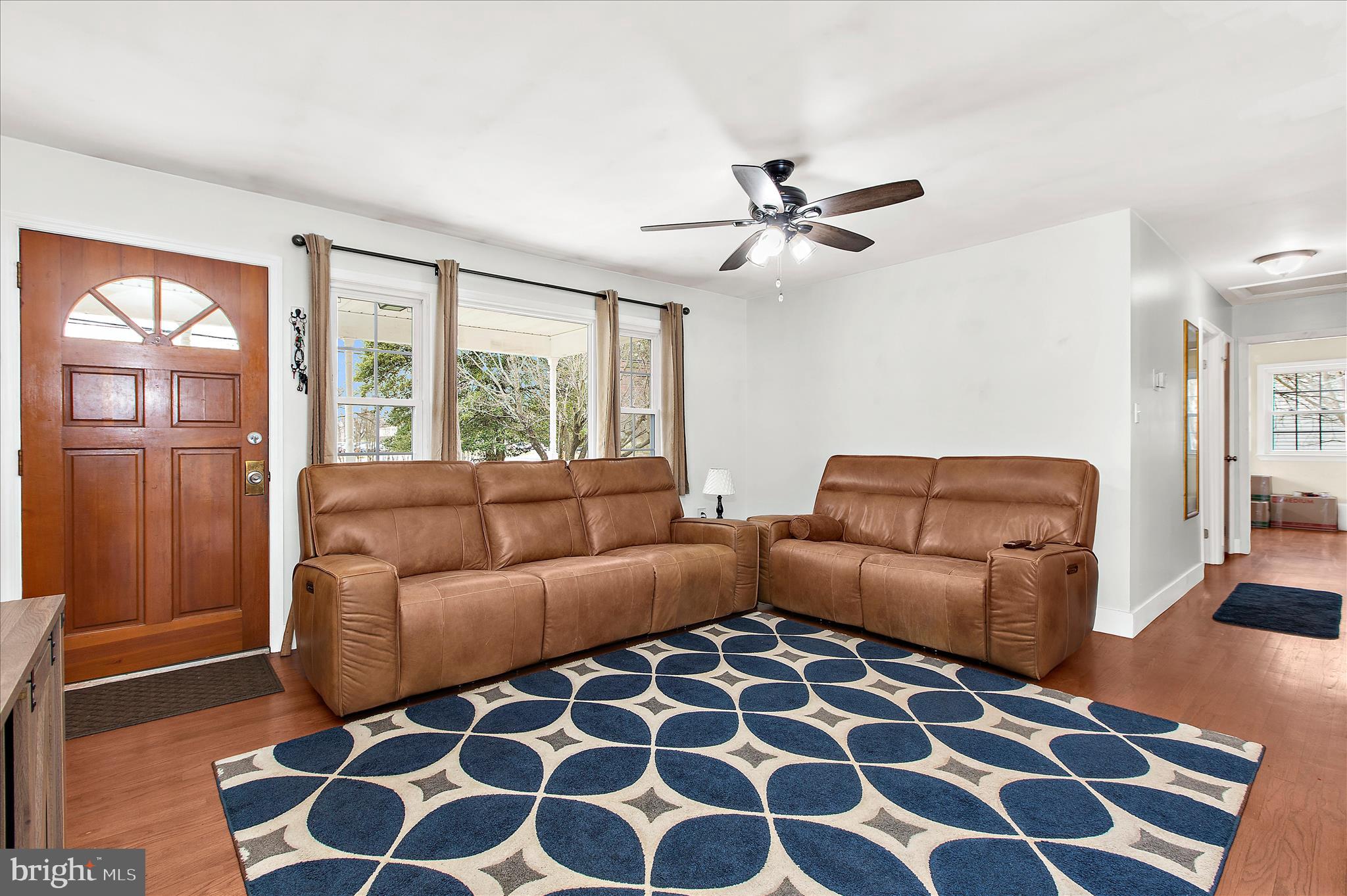 9140 Vollmerhausen Road Savage, MD 20794 - Photo 4 of 49 a living room with furniture and a rug