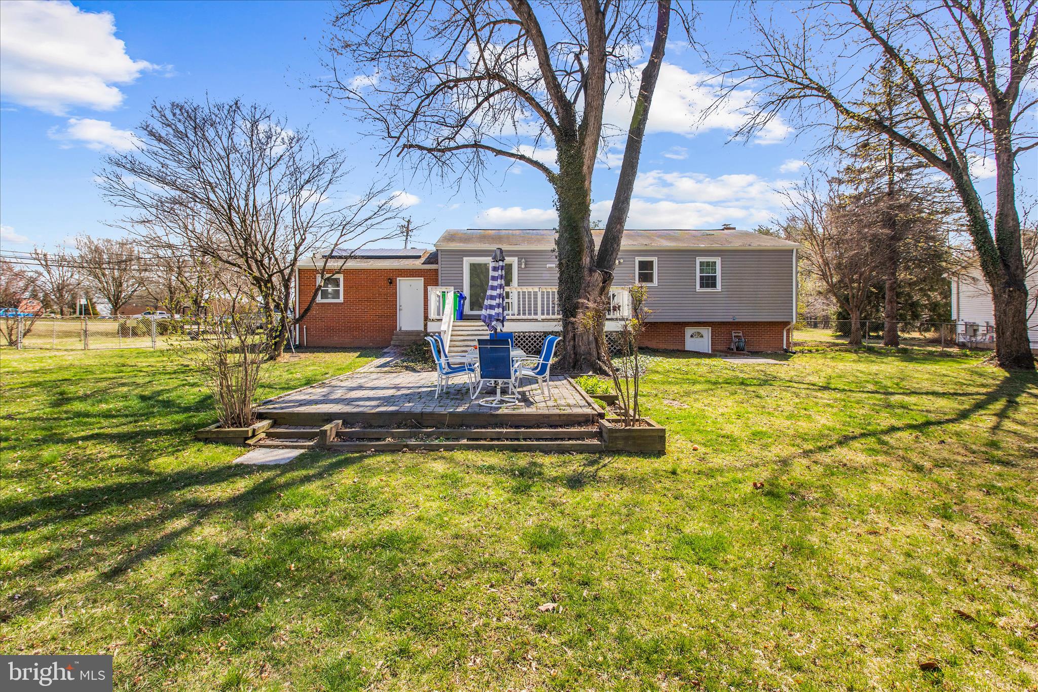 9140 Vollmerhausen Road Savage, MD 20794 - Photo 43 of 49 a view of a house with swimming pool next to a big yard