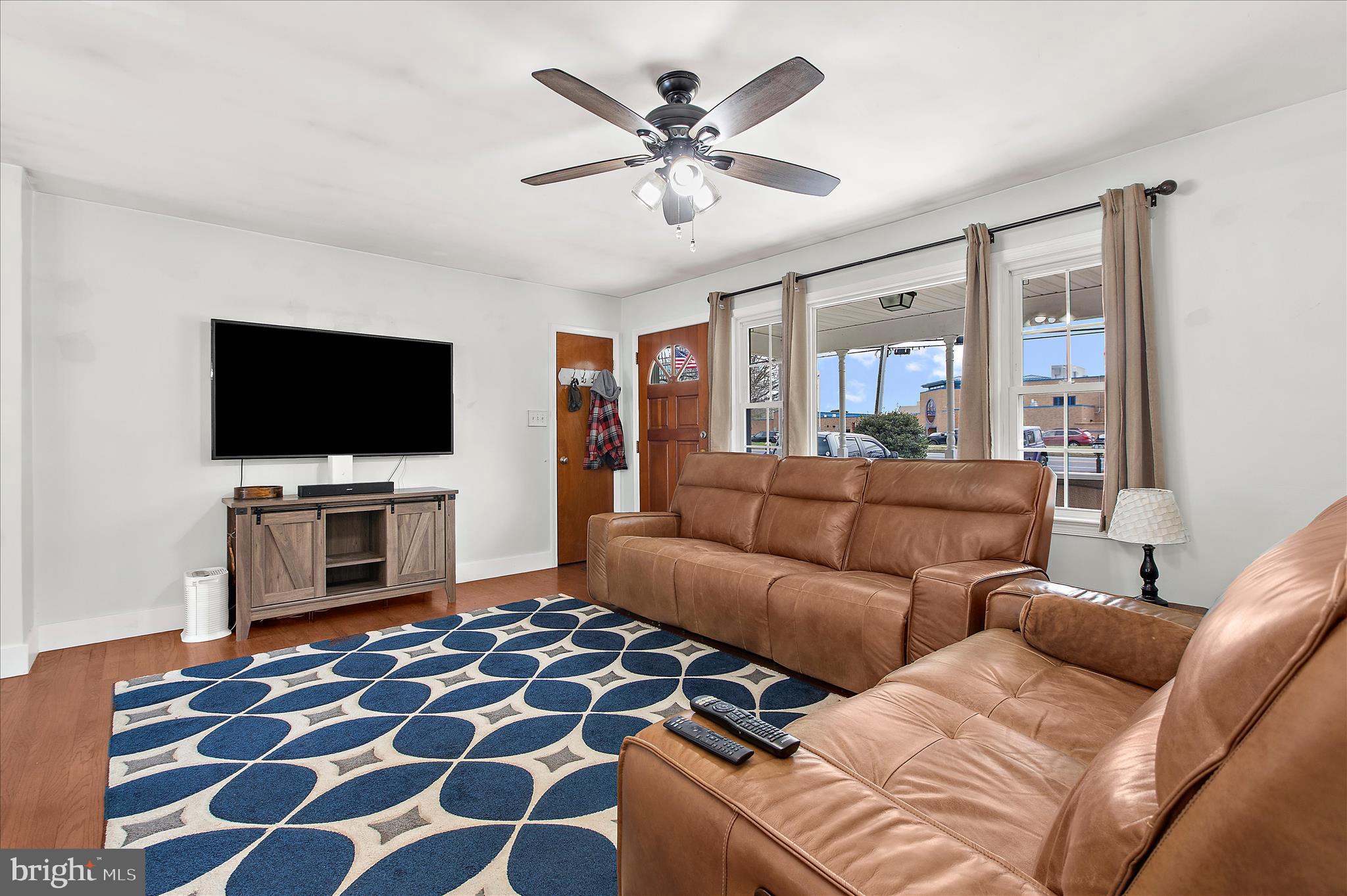9140 Vollmerhausen Road Savage, MD 20794 - Photo 5 of 49 a living room with furniture and a flat screen tv
