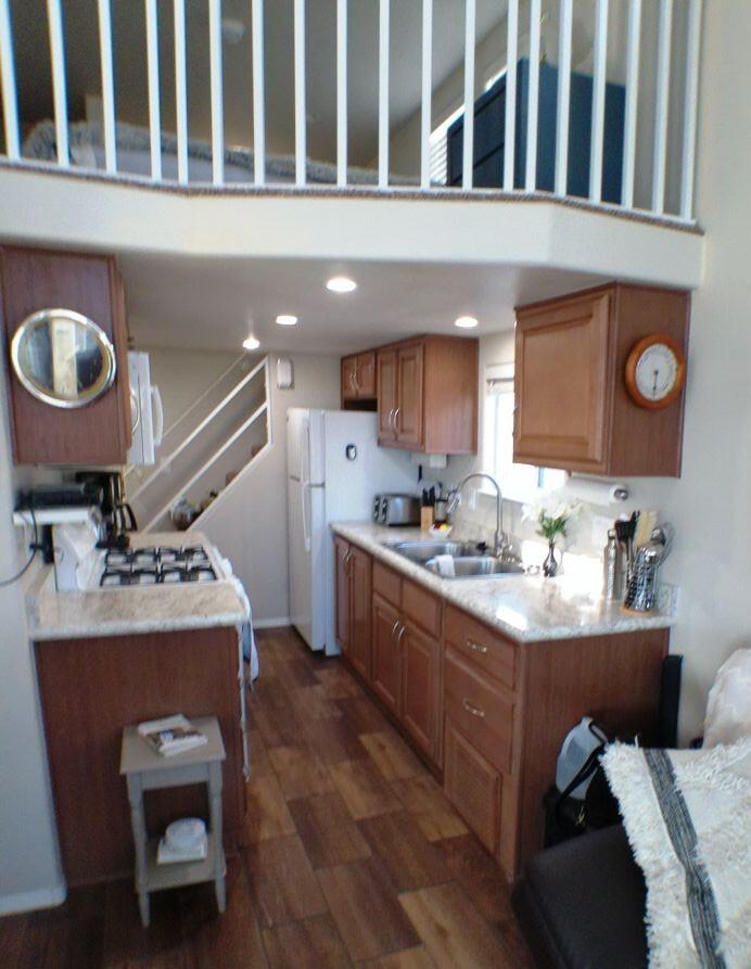 84136 Ave 44, Unit 125 Indio, CA 92203 - Photo 36 of 71 a kitchen with a stove a refrigerator and a stove