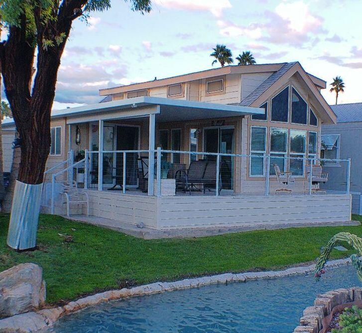 84136 Ave 44, Unit 125 Indio, CA 92203 - Photo 6 of 71 a front view of a house with a yard