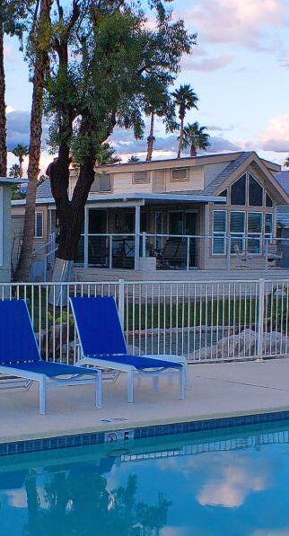 84136 Ave 44, Unit 125 Indio, CA 92203 - Photo 8 of 71 a front view of a house with a yard