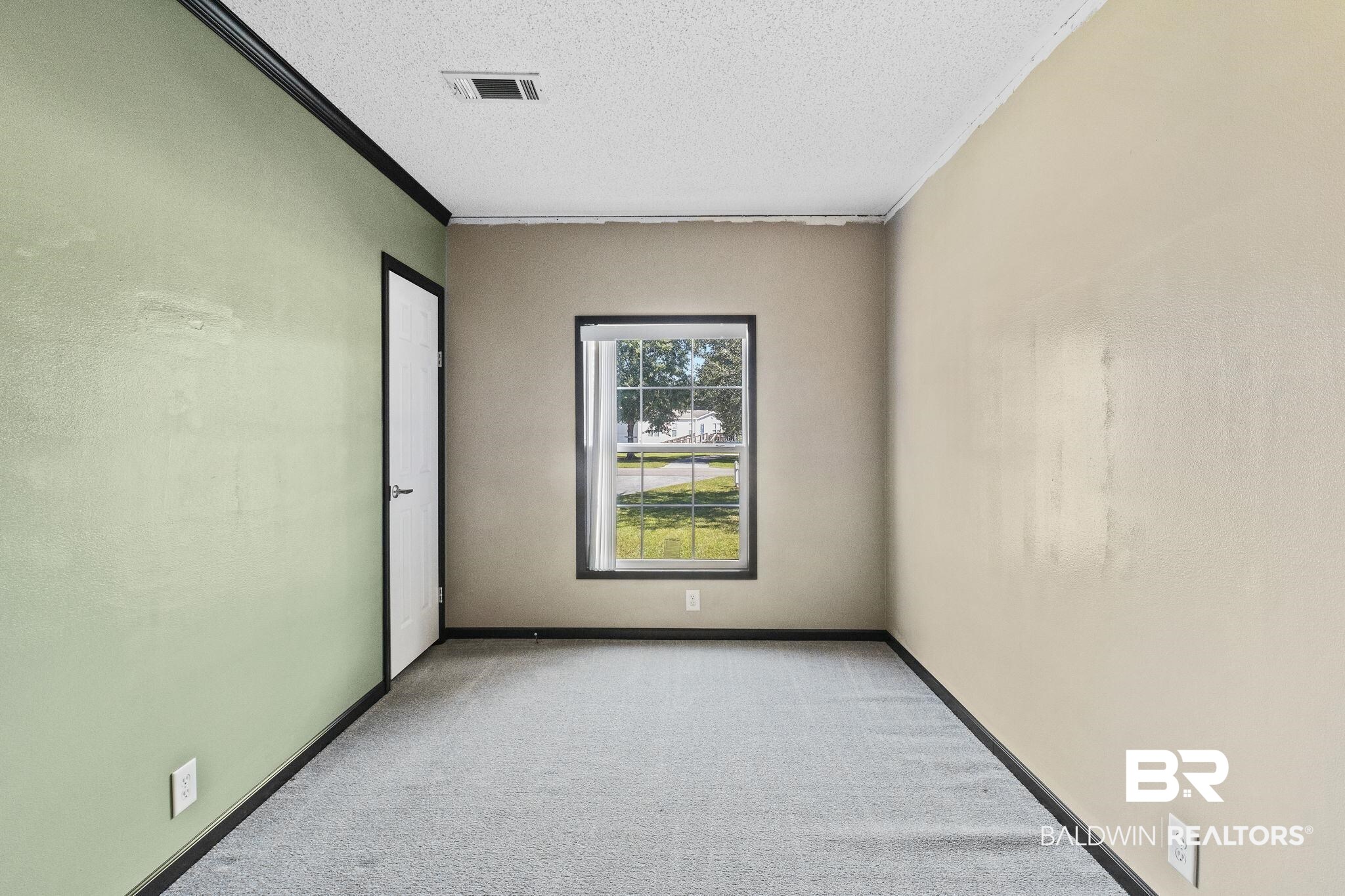 6870 Cecilia Court Theodore, AL 36582 - Photo 45 of 83 Carpeted spare room featuring ornamental molding and a textured ceiling
