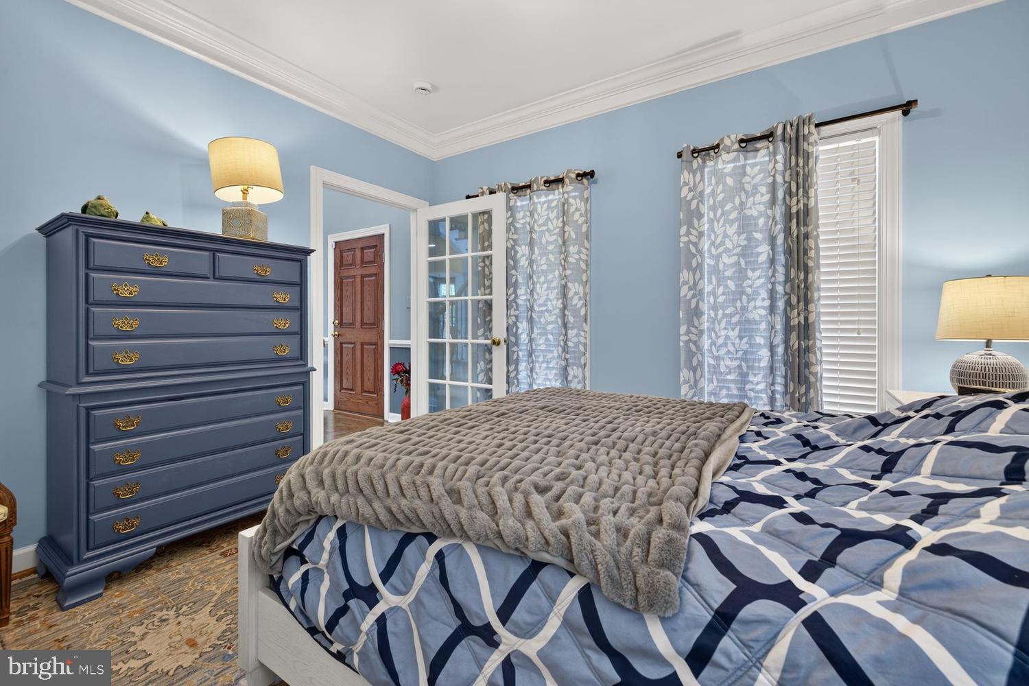 23106 Birch Mead Road Clarksburg, MD 20871 - Photo 29 of 60 a bedroom with a bed and dresser with mirror
