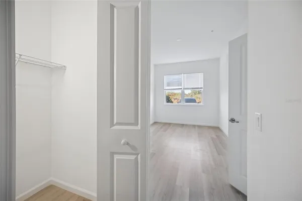 a view of an empty room and a window