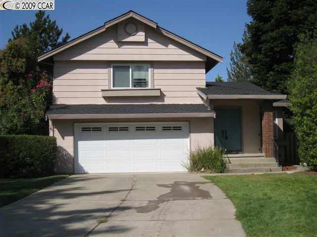 65 Trailview Court San Ramon, CA 94583 - Photo 1 of 1 a front view of a house with a yard and garage