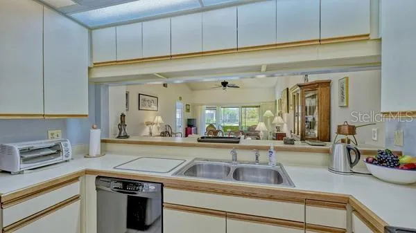 a kitchen with a sink and cabinets