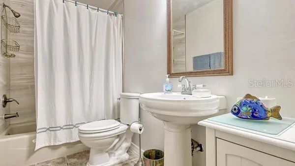 a bathroom with a sink and a toilet