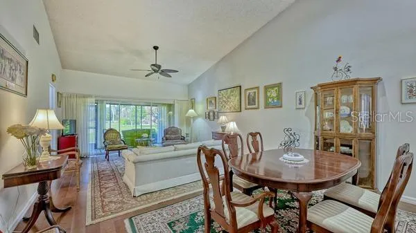 a view of a dining room with furniture window and outside view
