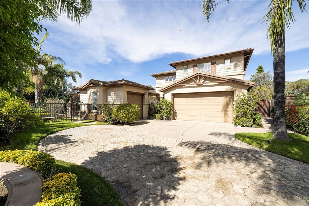 29031 Bouquet Canyon Road Silverado, CA 92676 - Photo 13 of 26 a front view of a house with a yard and garage