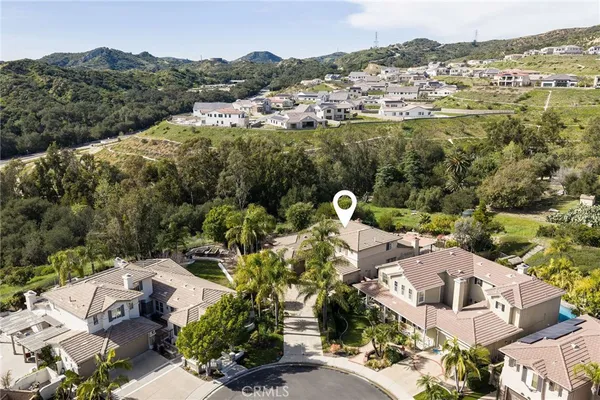 an aerial view of a house with a garden