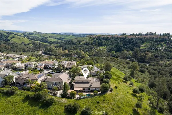 an aerial view of a house with a garden