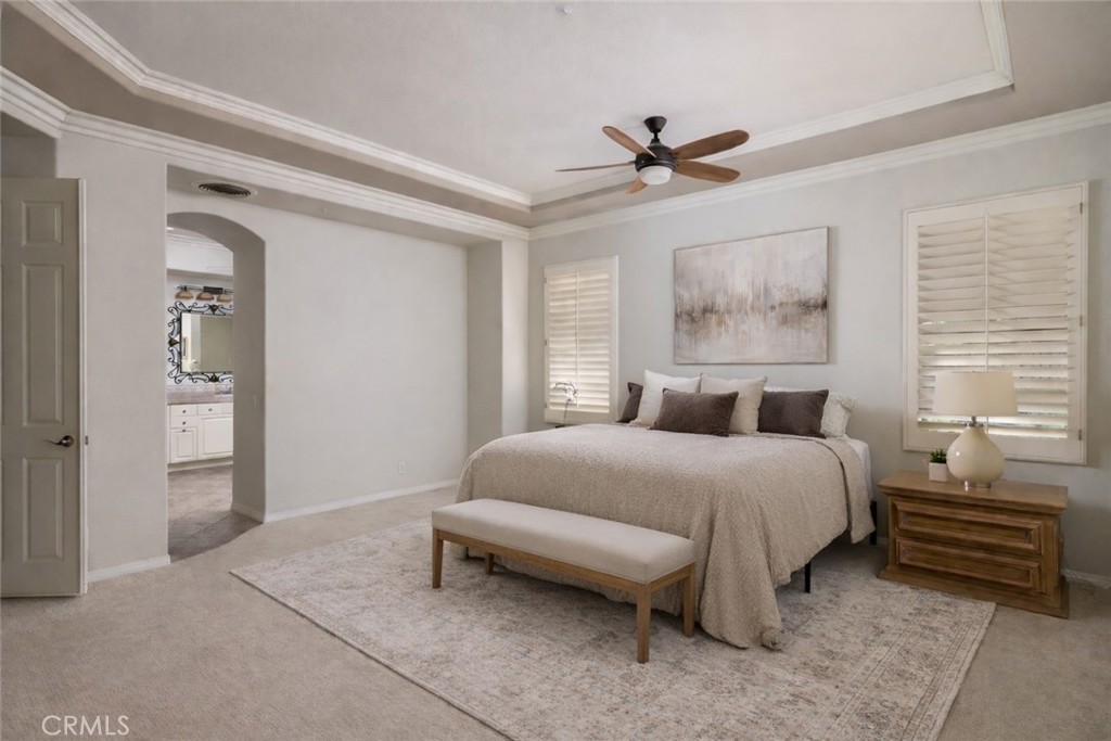 29031 Bouquet Canyon Road Silverado, CA 92676 - Photo 6 of 26 a bedroom with a bed and a chandelier