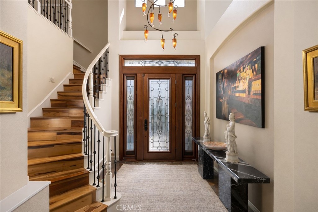 29031 Bouquet Canyon Road Silverado, CA 92676 - Photo 8 of 26 a view of a hallway with wooden floor and entryway