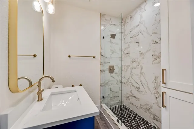 a bathroom with a sink and a shower