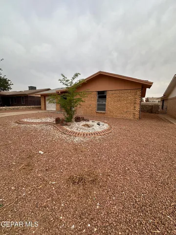 a big house with a big yard and large trees