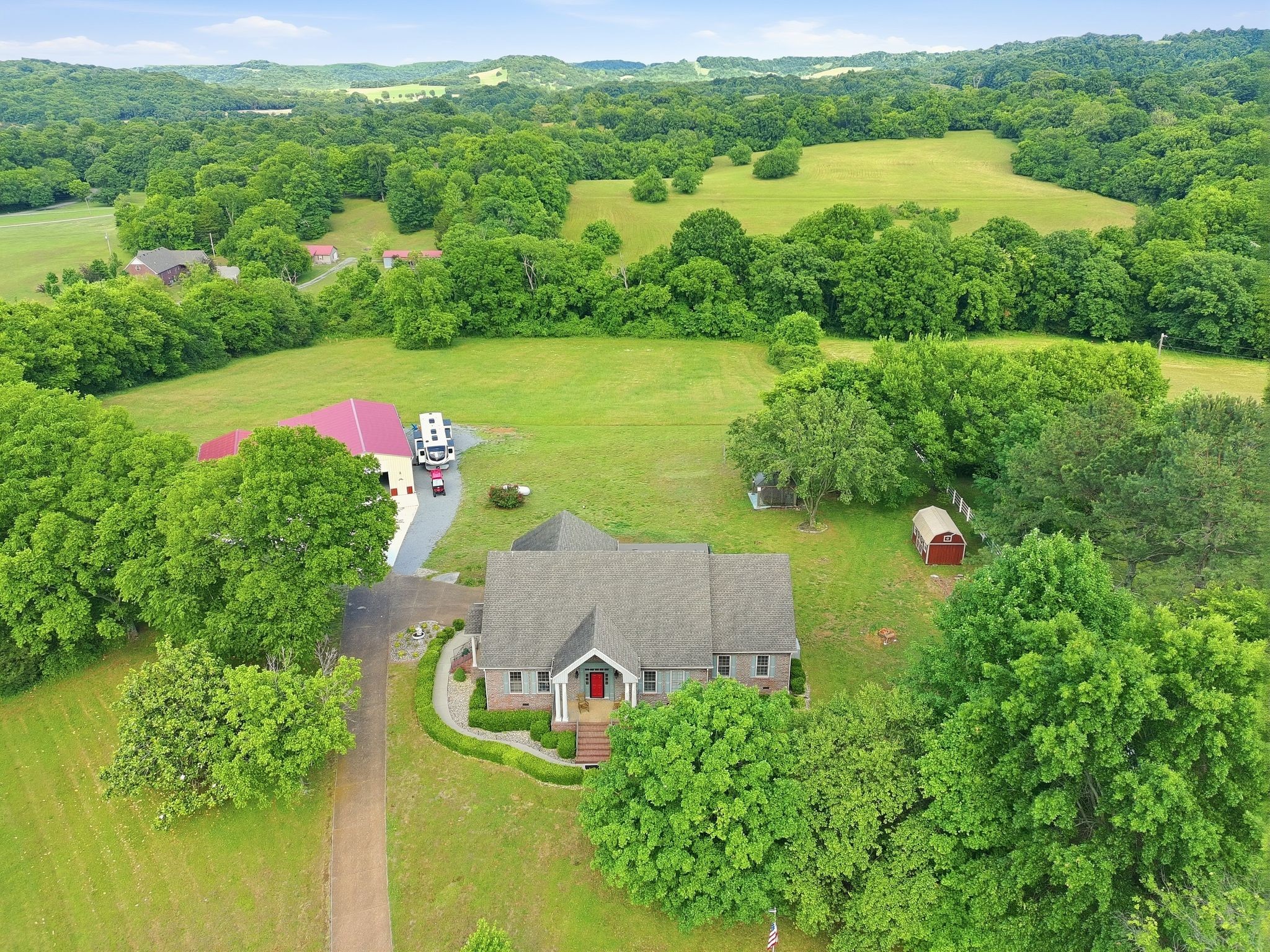 1150 Cochran Cemetery Road Lewisburg, TN 37091 - Photo 3 of 63 an aerial view of a houses with a yard and lake view