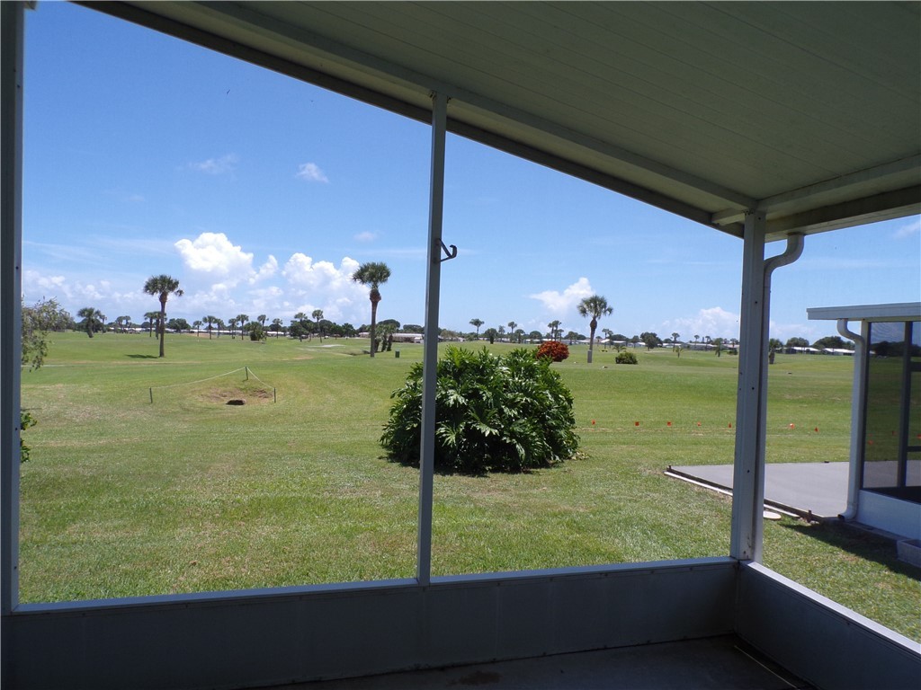 1126 Barefoot Circle Barefoot Bay, FL 32976 - Photo 8 of 16 a view of a lake from a balcony