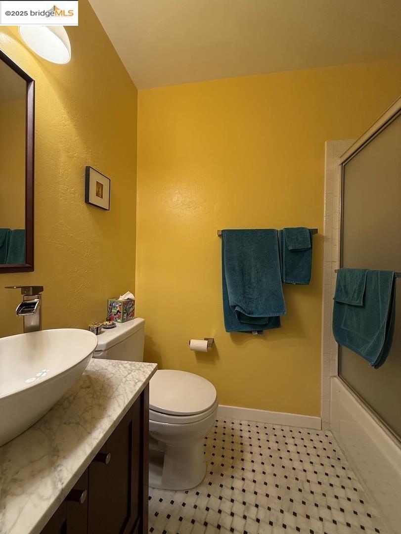 Domingo Avenue Berkeley, CA 94705 - Photo 23 of 43 a bathroom with a sink a toilet and mirror