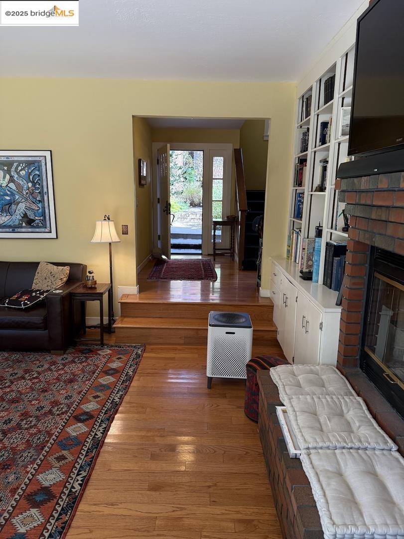 Domingo Avenue Berkeley, CA 94705 - Photo 5 of 43 a living room with fireplace furniture and a flat screen tv