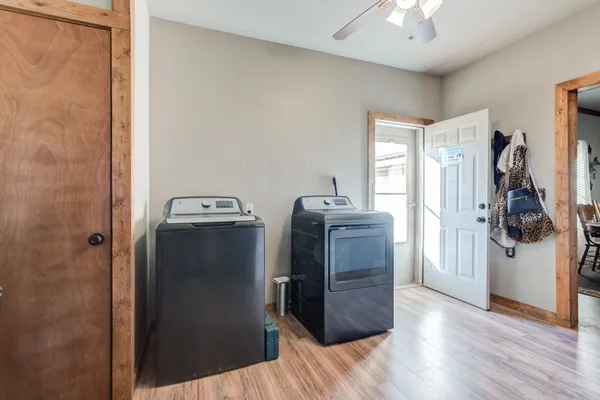 a view of a storage & utility room with a window