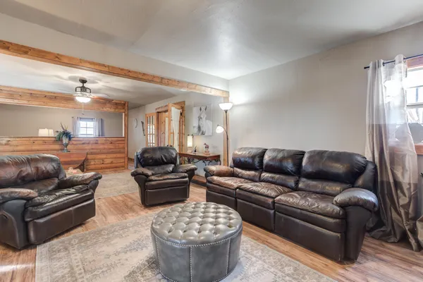 a living room with furniture and a large window