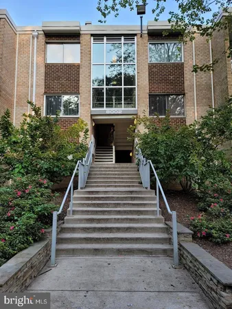 a view of a house with entryway and plants