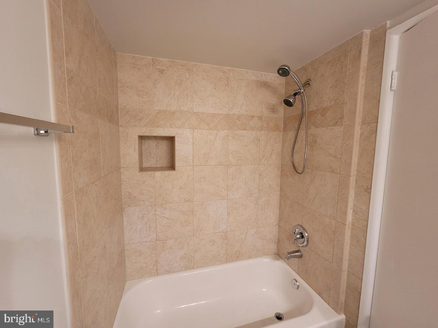 8002 Chanute Place, Unit 3 Falls Church, VA 22042 - Photo 11 of 19 a bathroom with a white bath tub