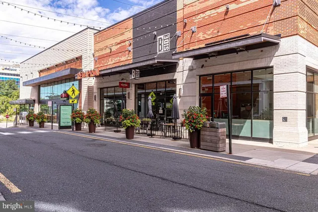 a view of a street with stores