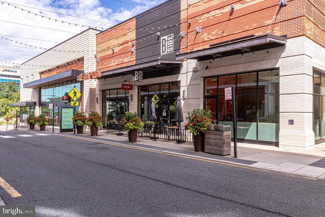 8002 Chanute Place, Unit 3 Falls Church, VA 22042 - Photo 16 of 19 a view of a street with stores