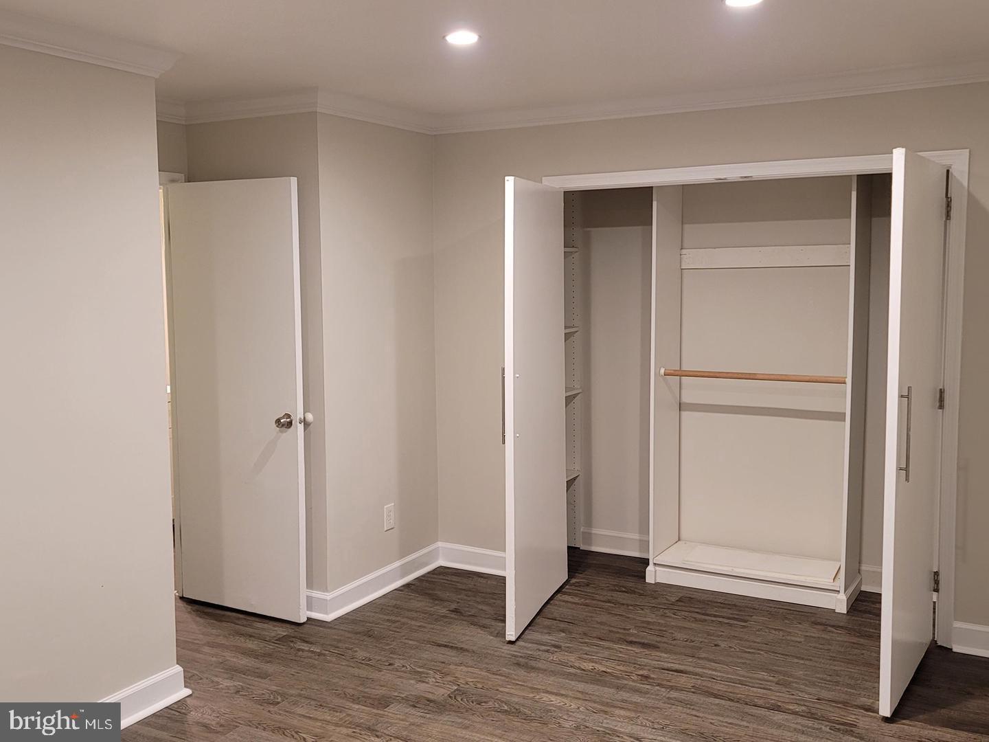 8002 Chanute Place, Unit 3 Falls Church, VA 22042 - Photo 9 of 19 a view of an empty room with wooden floor & closet