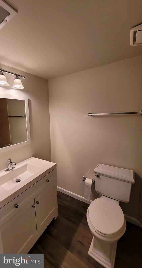 8002 Chanute Place, Unit 3 Falls Church, VA 22042 - Photo 10 of 19 a bathroom with a toilet sink and mirror
