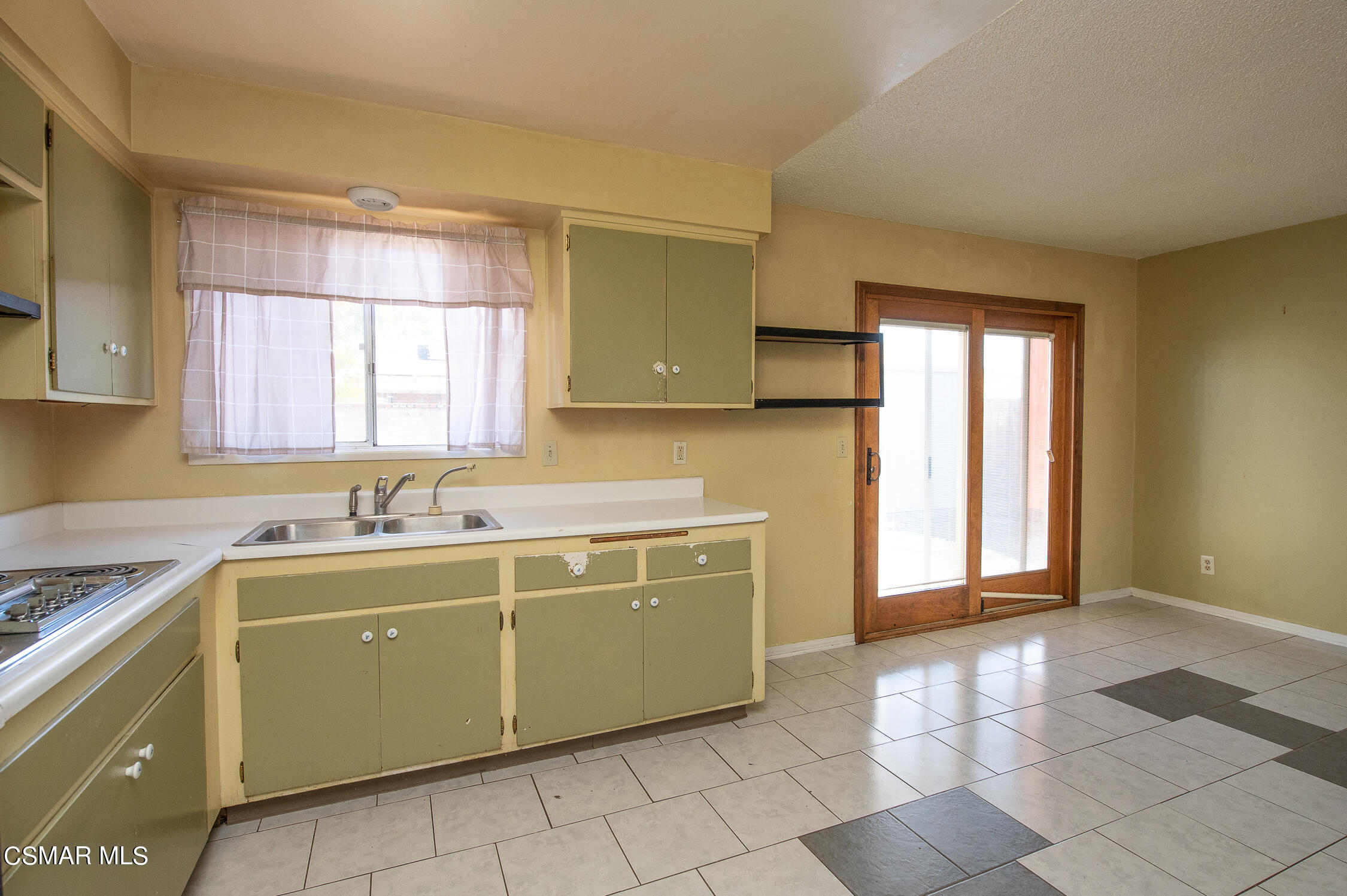 492 Graham Avenue Camarillo, CA 93010 - Photo 12 of 33 a kitchen with a sink and cabinets