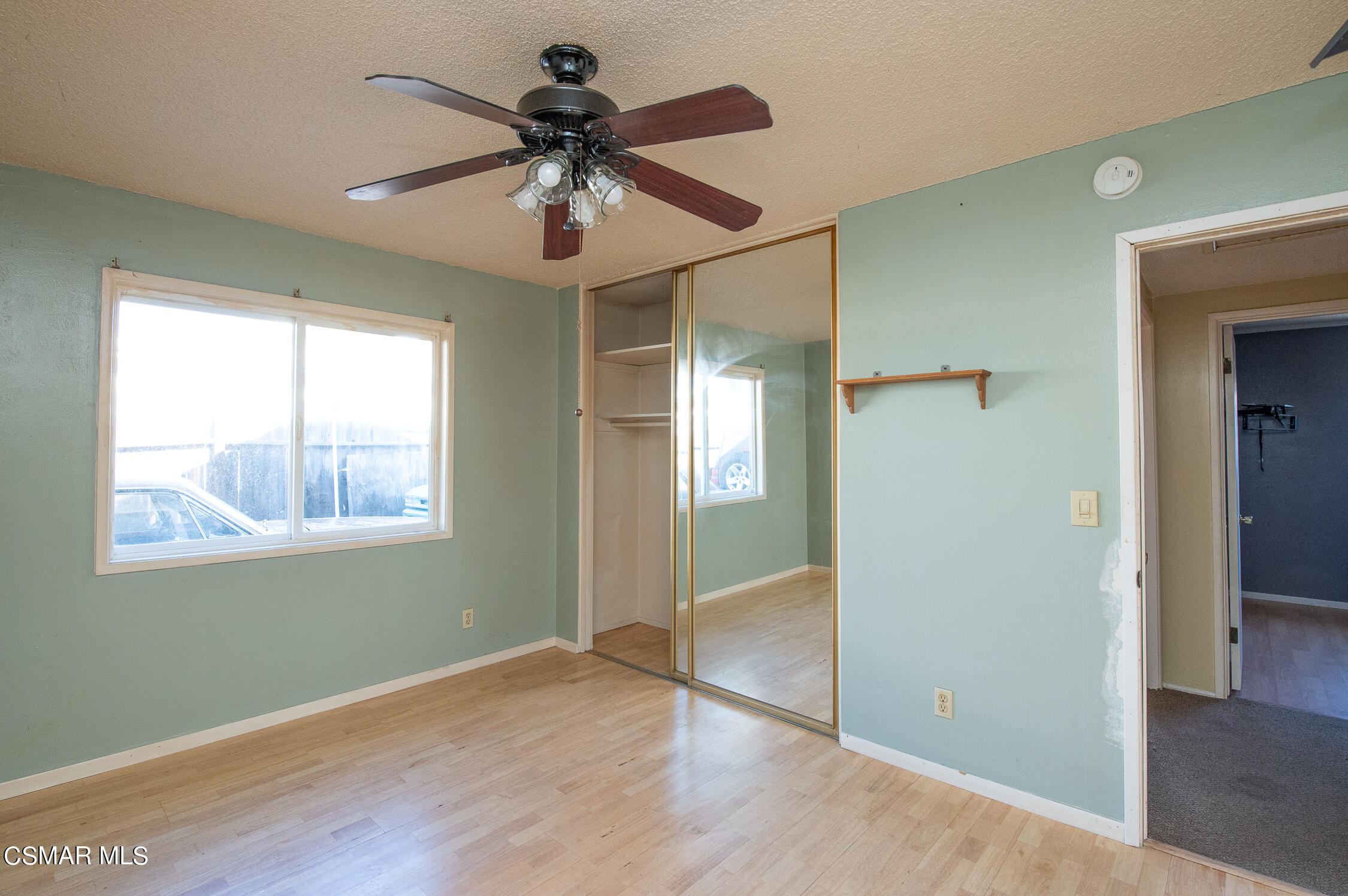 492 Graham Avenue Camarillo, CA 93010 - Photo 18 of 33 a view of an empty room with wooden floor and a window