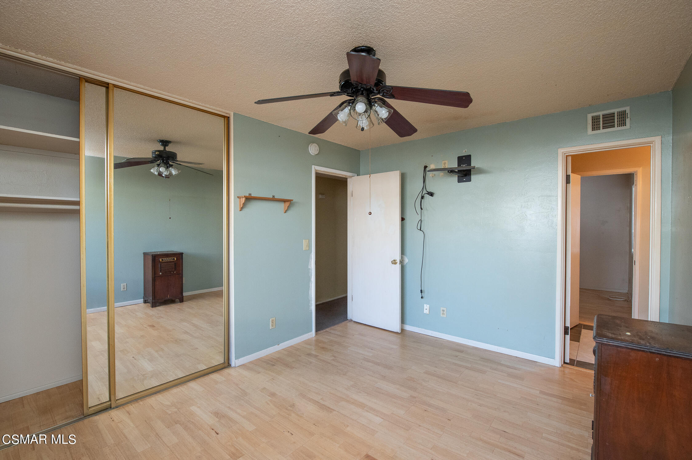 492 Graham Avenue Camarillo, CA 93010 - Photo 19 of 33 a view of a livingroom with a chandelier fan and wooden floor