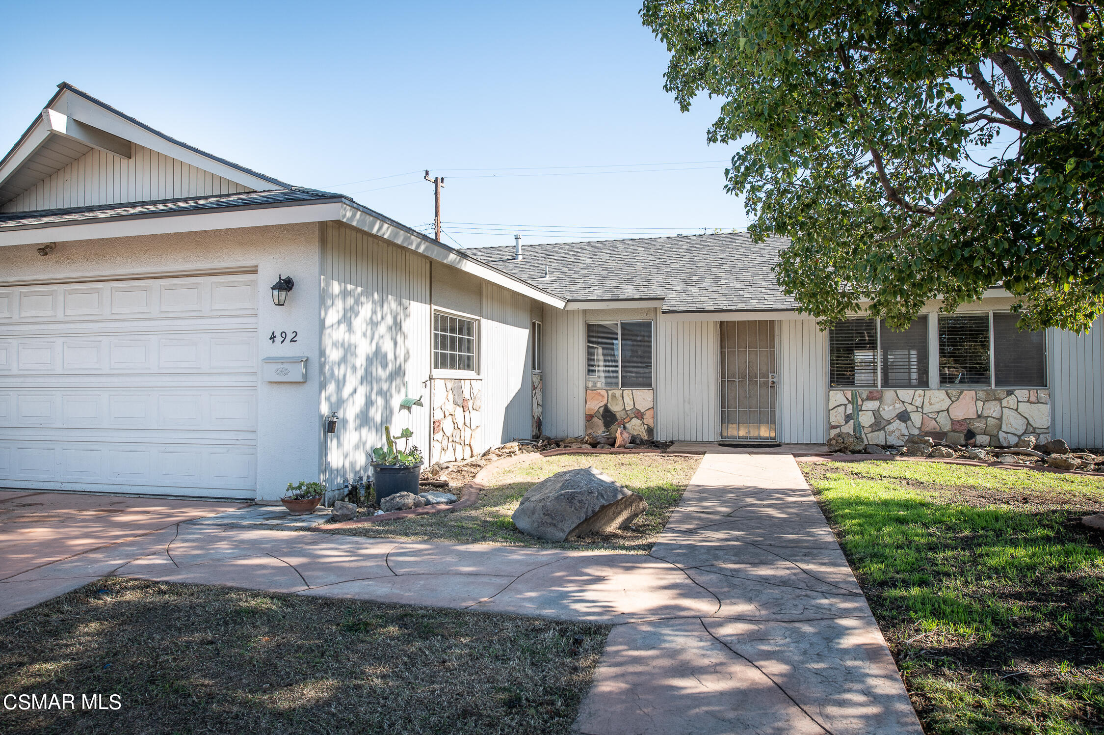 492 Graham Avenue Camarillo, CA 93010 - Photo 2 of 33 a front view of a house with a yard and garage