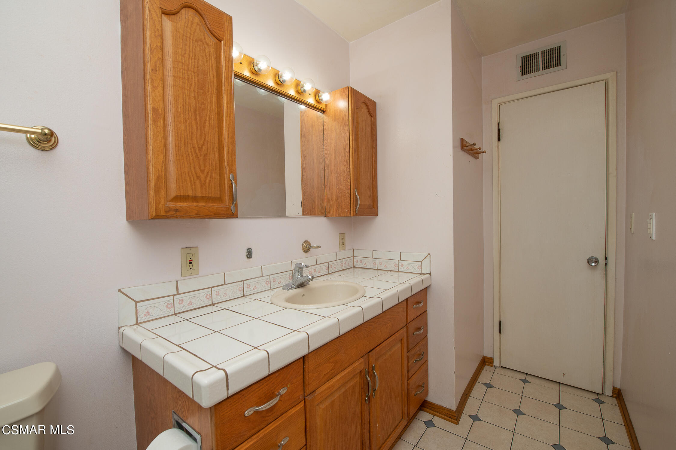492 Graham Avenue Camarillo, CA 93010 - Photo 26 of 33 a bathroom with a sink and a mirror