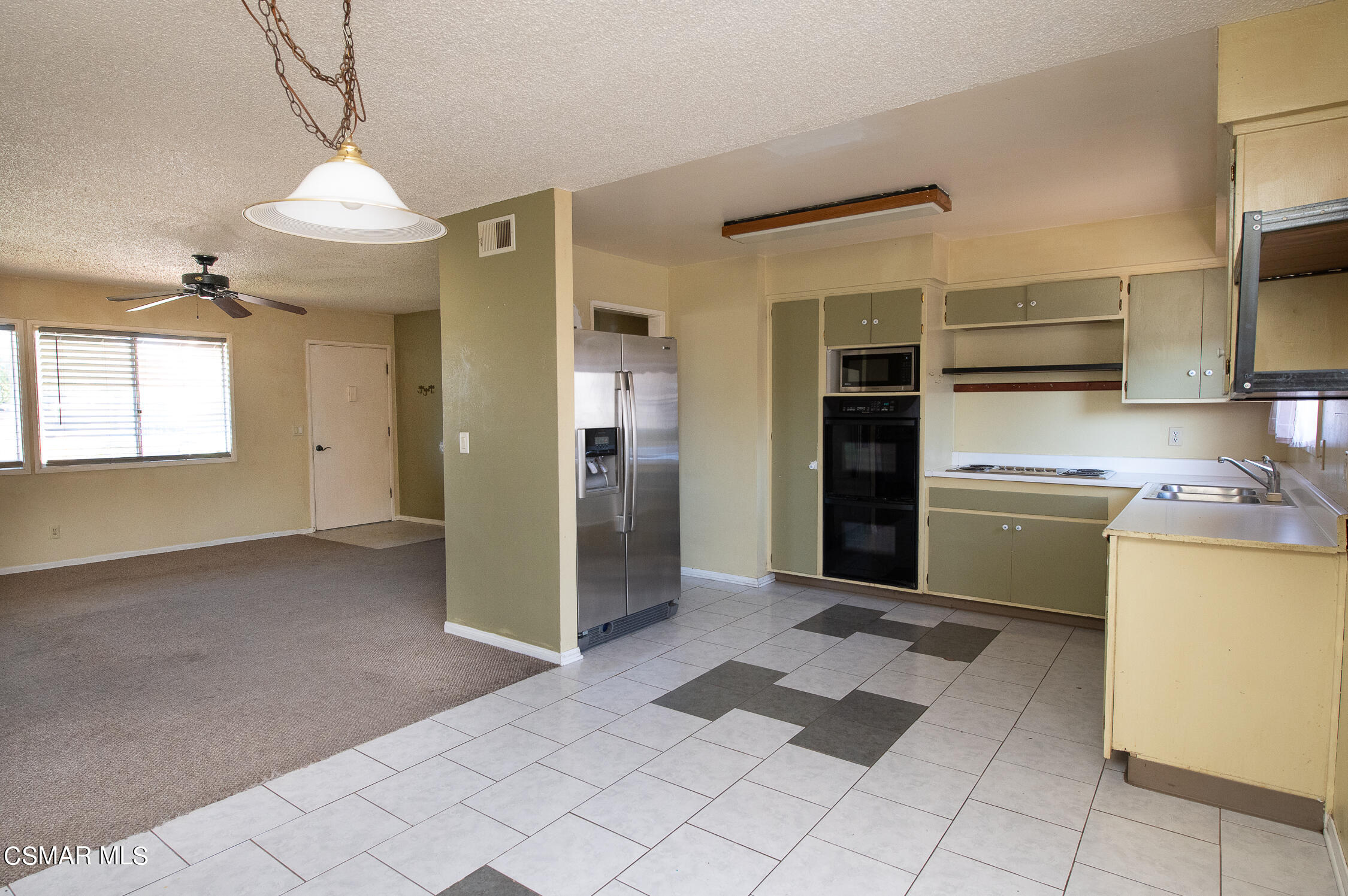 492 Graham Avenue Camarillo, CA 93010 - Photo 8 of 33 a view of a kitchen with an empty space and a window