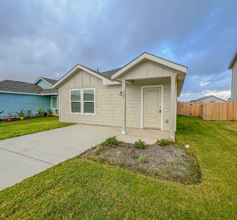 129 Hellcats Way Jarrell, TX 76537 - Photo 1 of 19 View of front of house with board and batten siding