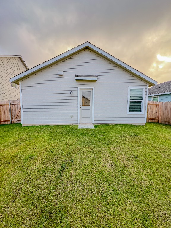 129 Hellcats Way Jarrell, TX 76537 - Photo 19 of 19 Back of house with a fenced backyard