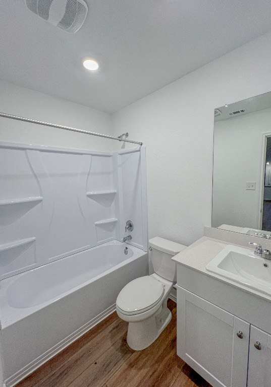 129 Hellcats Way Jarrell, TX 76537 - Photo 5 of 19 Full bathroom with shower / washtub combination, vanity, light wood-type flooring, and recessed lighting