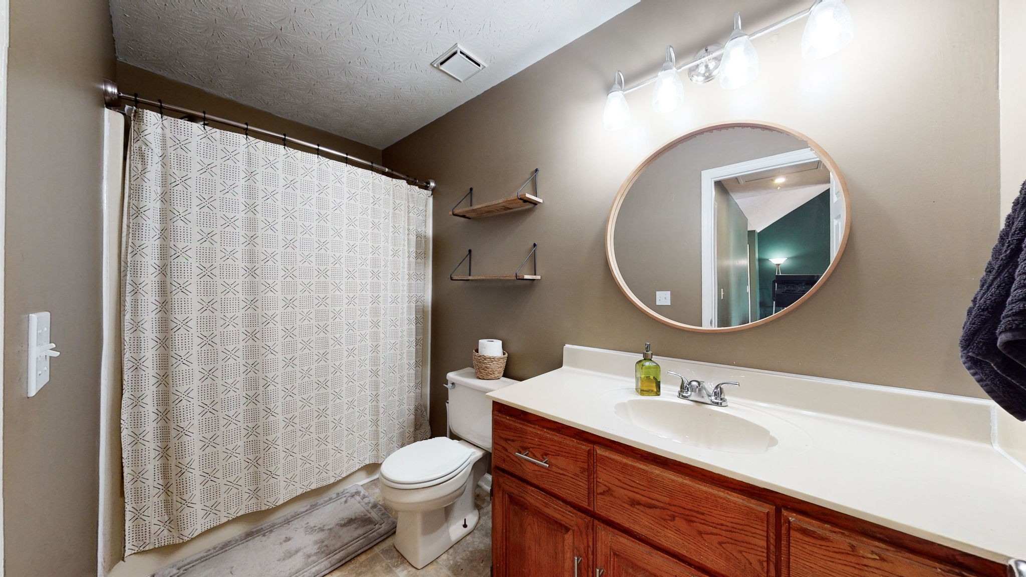 3558 Raymond Head Road Springfield, TN 37172 - Photo 33 of 50 a bathroom with a sink vanity mirror and toilet